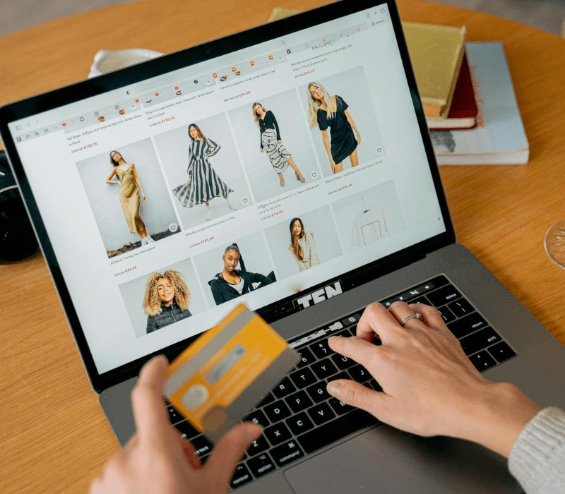 Online shopping on laptop with credit card – E-Commerce Development Company in Kochi